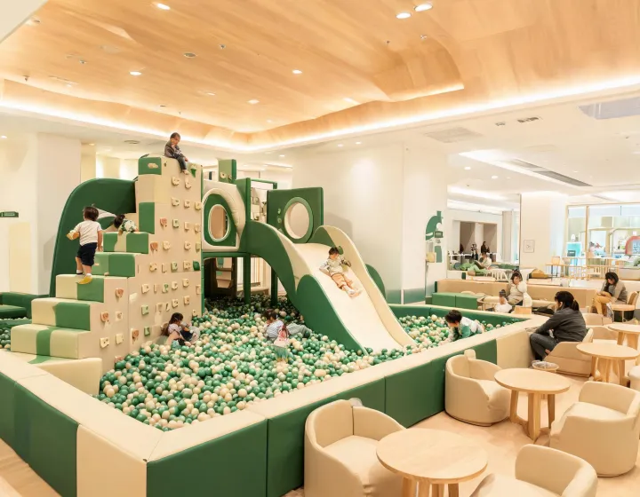 Indoor soft play structure with slides and ball pit